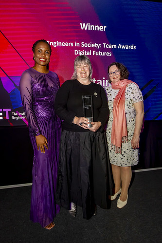 The Digital Roads Project Manager collecting the Award on behalf of the Team